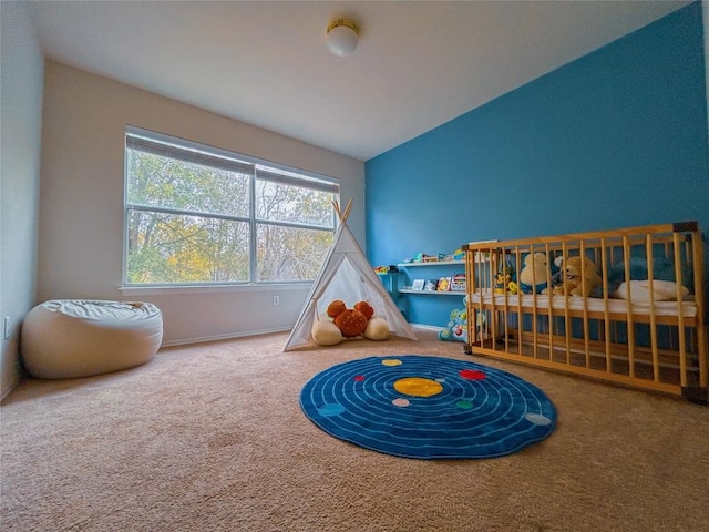 playroom with carpet floors and lofted ceiling