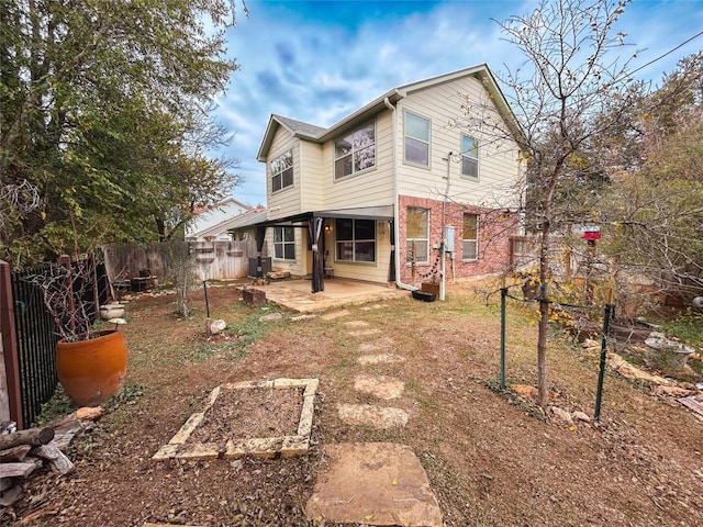 rear view of property with a patio area