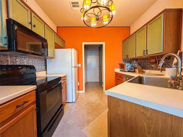 kitchen with an inviting chandelier, black appliances, sink, hanging light fixtures, and tasteful backsplash