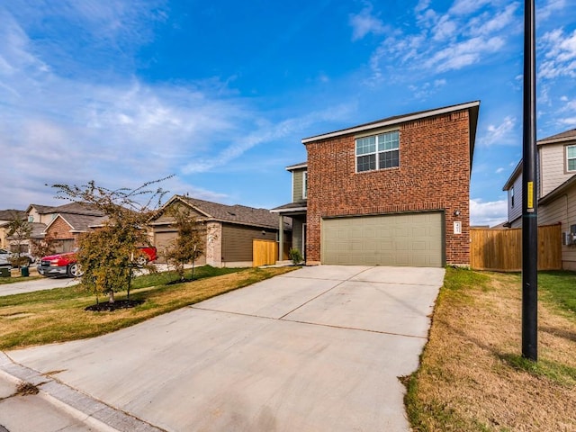 view of front property with a garage and a front yard