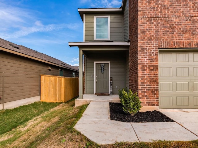 doorway to property featuring a yard