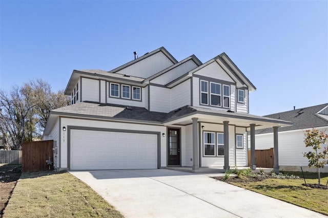 113 Wagon Spoke Way, Liberty Hill, TX 78642 - traditional home with concrete driveway, a garage, covered porch, and board and batten siding