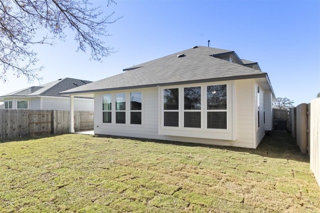 113 Wagon Spoke Way, Liberty Hill, TX 78642 - rear view of property with a fenced backyard and roof with shingles