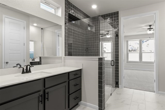 113 Wagon Spoke Way, Liberty Hill, TX 78642 - bathroom with marble finish floors, a shower stall, vanity, ceiling fan, and healthy amount of natural light