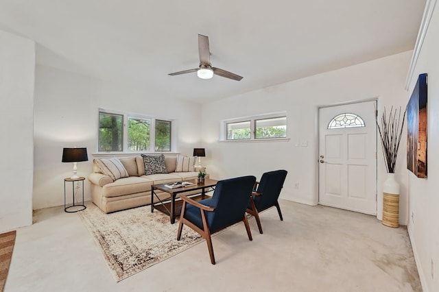 carpeted living room featuring ceiling fan