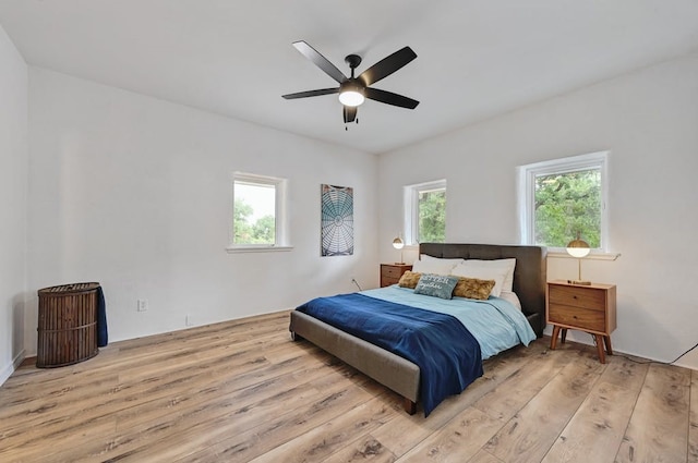 bedroom featuring ceiling fan and light hardwood / wood-style flooring