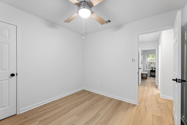 unfurnished room with ceiling fan and light hardwood / wood-style floors