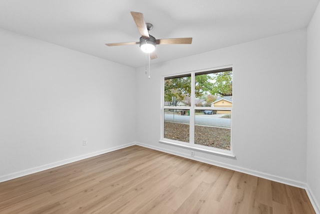 unfurnished room with ceiling fan and light hardwood / wood-style flooring