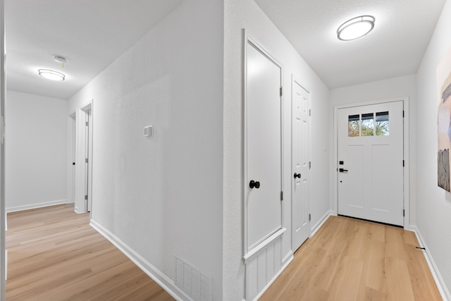 hallway featuring light wood-type flooring