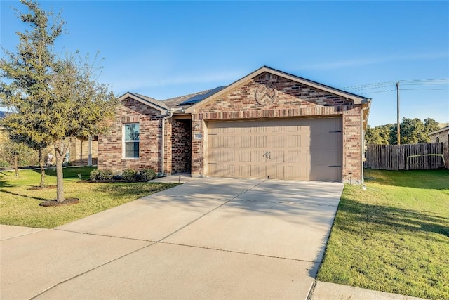 single story home featuring solar panels, a garage, and a front lawn