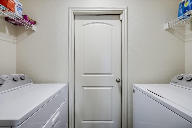 washroom featuring washer and dryer