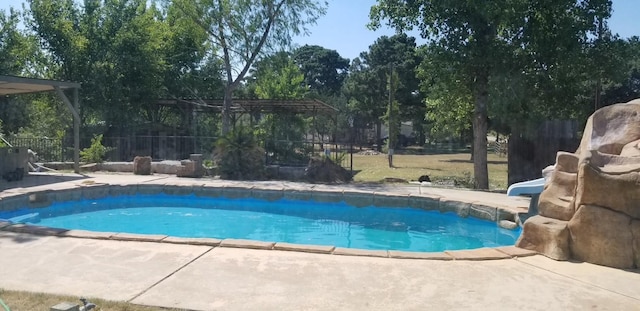 view of swimming pool featuring a patio