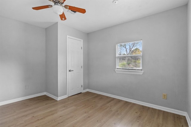 spare room with ceiling fan and light hardwood / wood-style floors