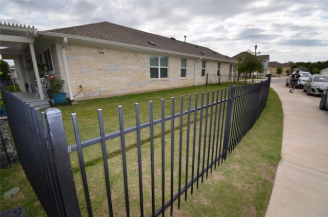 view of side of property featuring a yard