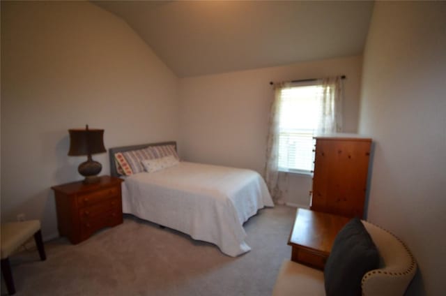 carpeted bedroom featuring vaulted ceiling