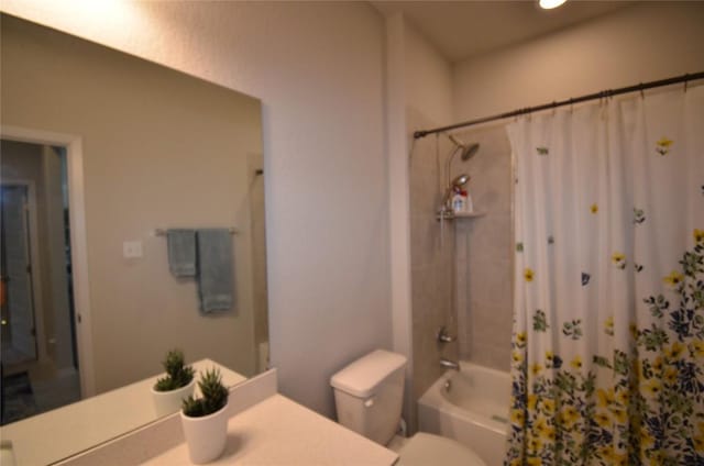 full bathroom featuring vanity, toilet, and shower / tub combo