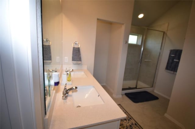 bathroom with vanity, tile patterned floors, and a shower with door