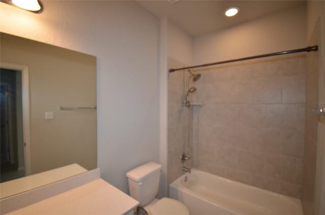 bathroom with shower / bath combination, recessed lighting, toilet, and vanity