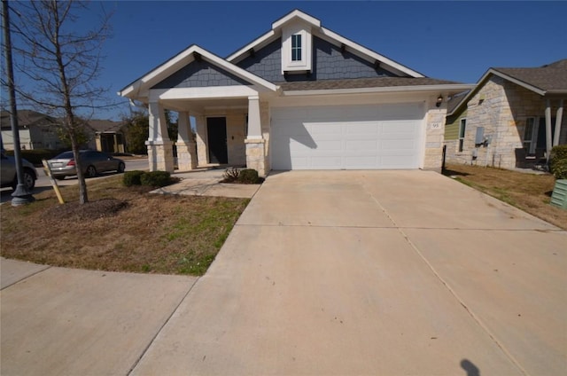 craftsman inspired home with stone siding, covered porch, concrete driveway, and a garage