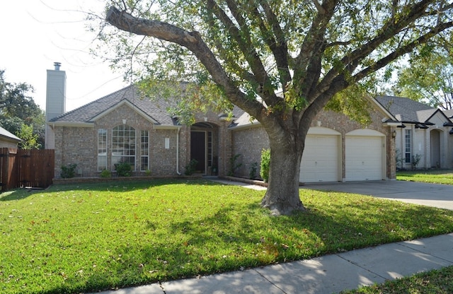 ranch-style home with a front lawn and a garage