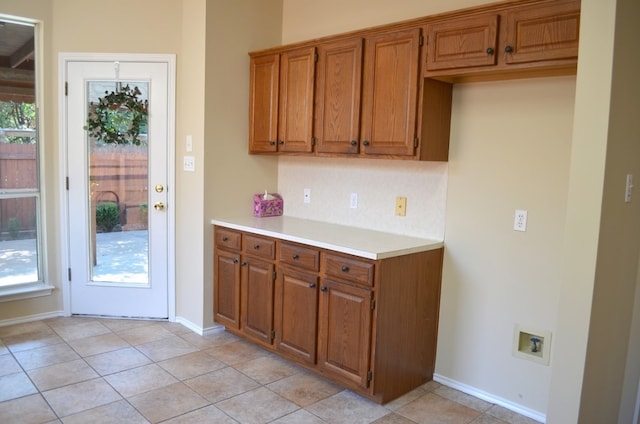 kitchen with light tile patterned floors and a wealth of natural light