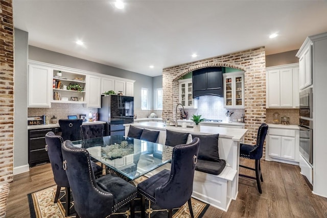 dining room with dark hardwood / wood-style flooring