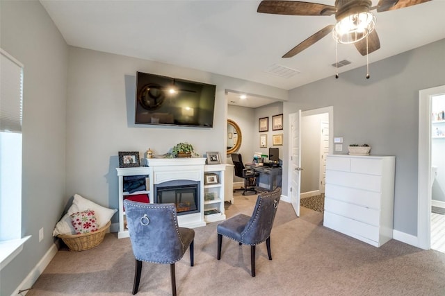 interior space featuring ceiling fan and carpet floors