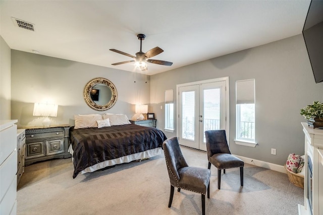 carpeted bedroom featuring french doors, ceiling fan, and access to outside