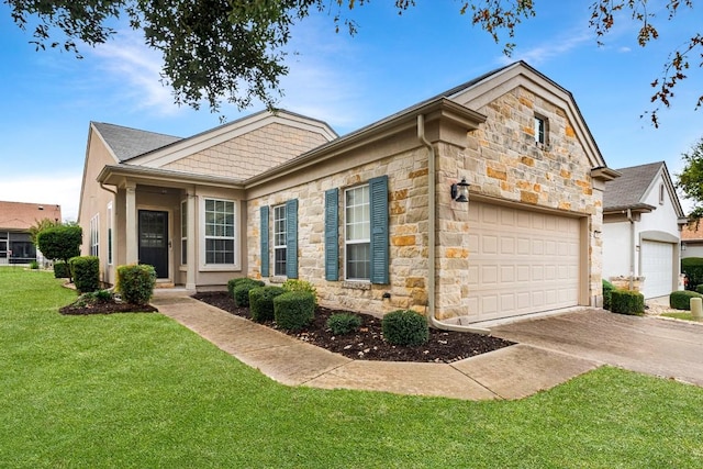 view of front of property featuring a front yard and a garage