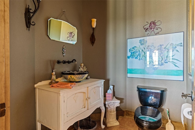 bathroom with tile patterned floors