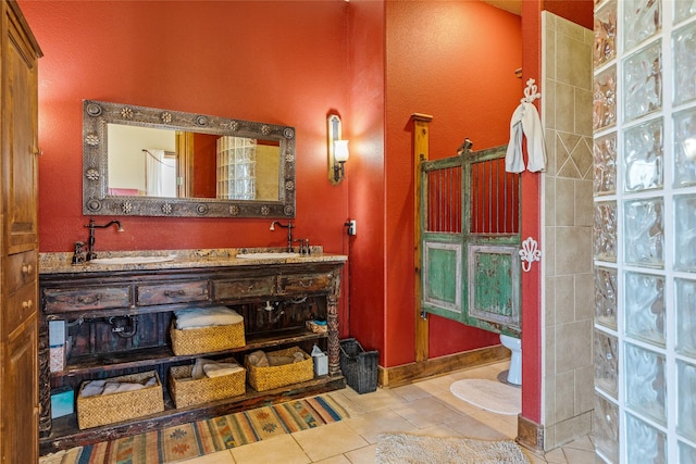 bathroom featuring vanity, tile patterned floors, and a shower