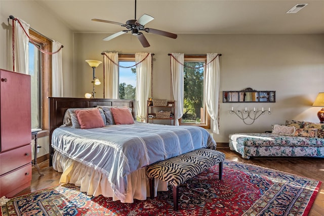 bedroom featuring hardwood / wood-style flooring and ceiling fan