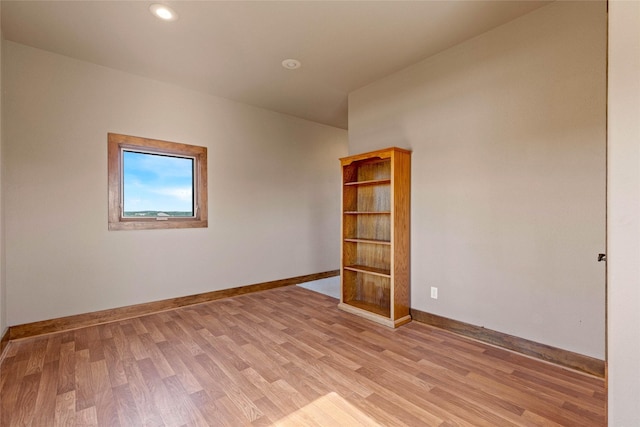 unfurnished room with light wood-type flooring