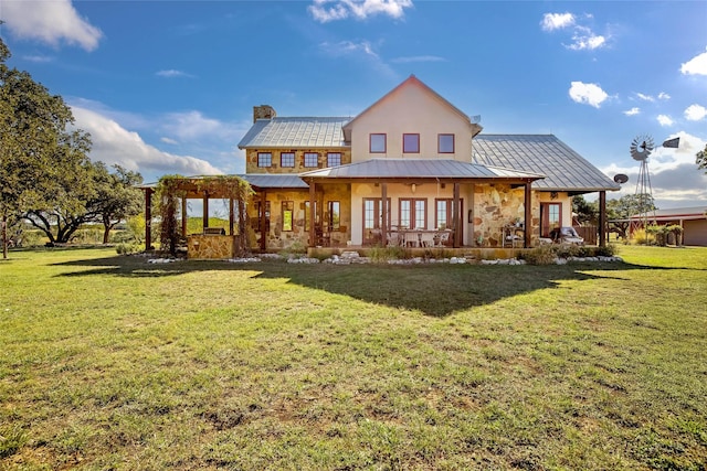 back of property with a porch, a yard, and a pergola