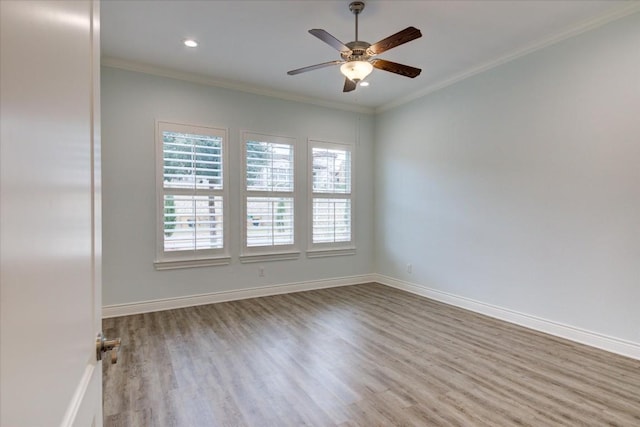 unfurnished room with ceiling fan, light hardwood / wood-style floors, and crown molding