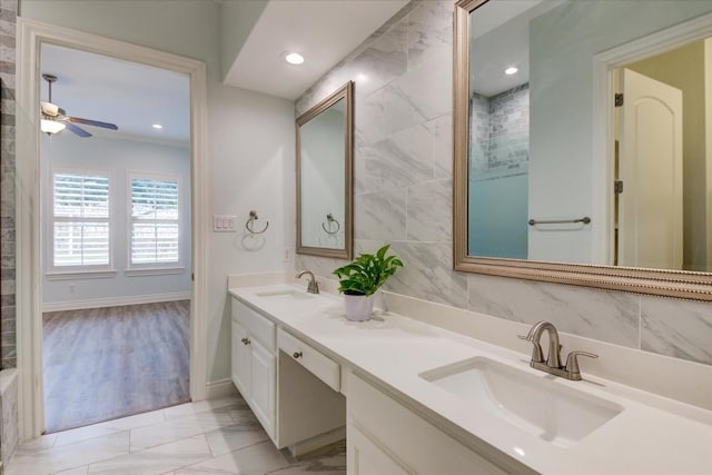 bathroom featuring vanity, ceiling fan, and tile walls