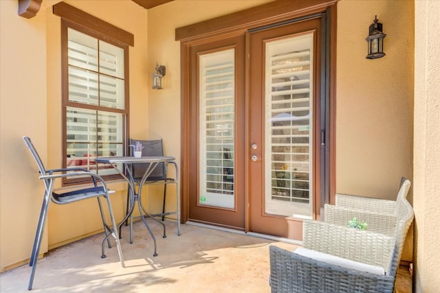 doorway to property with a patio area