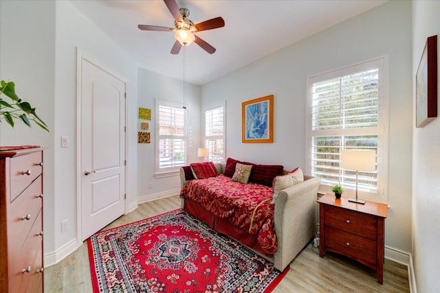 bedroom with ceiling fan and light hardwood / wood-style floors