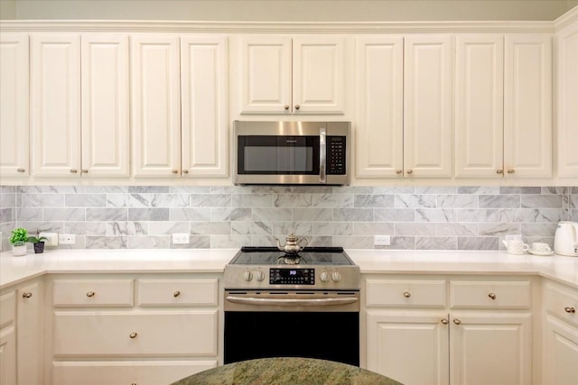 kitchen featuring backsplash and stainless steel appliances