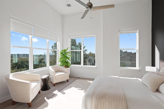 bedroom featuring hardwood / wood-style flooring and ceiling fan