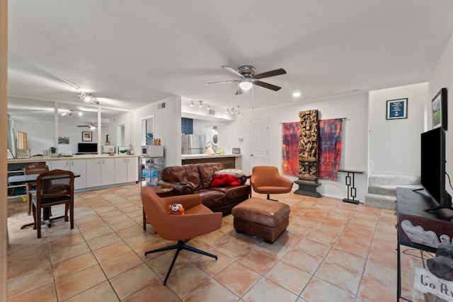 living room featuring ceiling fan, light tile patterned flooring, and track lighting