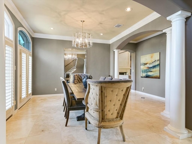 dining area with an inviting chandelier and crown molding