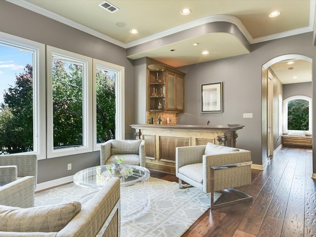 3001 Pescadero Cv, Austin, TX 78746 - interior space featuring crown molding, arched walkways, visible vents, baseboards, and dark wood-style floors