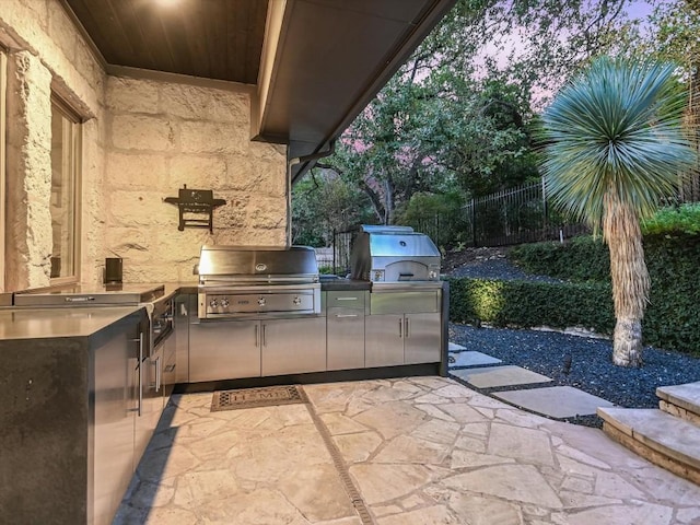 view of patio / terrace featuring grilling area and exterior kitchen