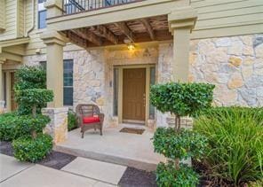 doorway to property featuring a balcony