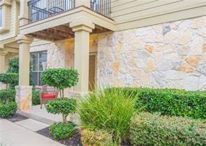 entrance to property with a balcony