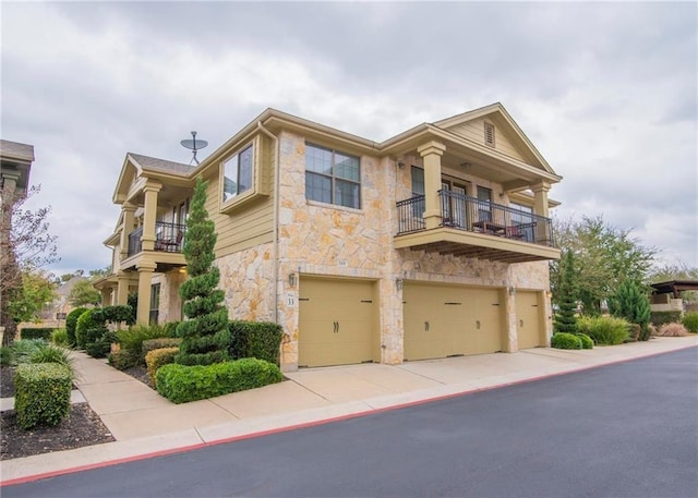 view of front of house with a balcony and a garage