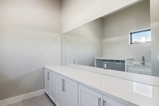 bathroom featuring tile patterned flooring and sink