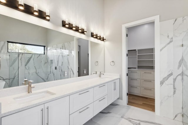 bathroom featuring vanity and a tile shower