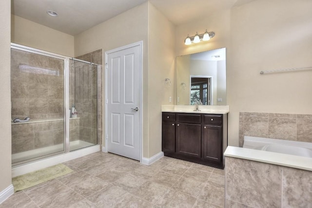 bathroom featuring vanity and separate shower and tub